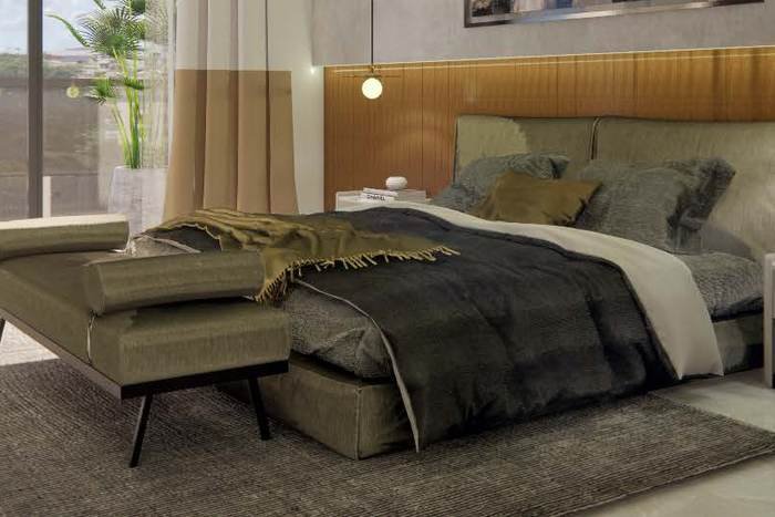 Bedroom in an Acasa apartment with a timber headboard wall