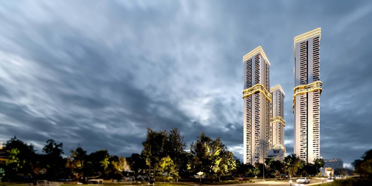 The five towers of Cinq by Raghava at dusk, seen from the landscaped approach